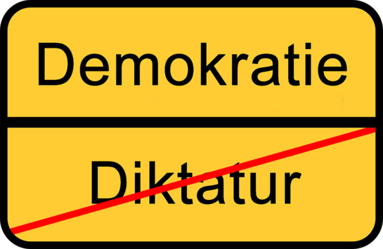 "Ortsschild" Ende der Diktatur, Anfang der Demokratie